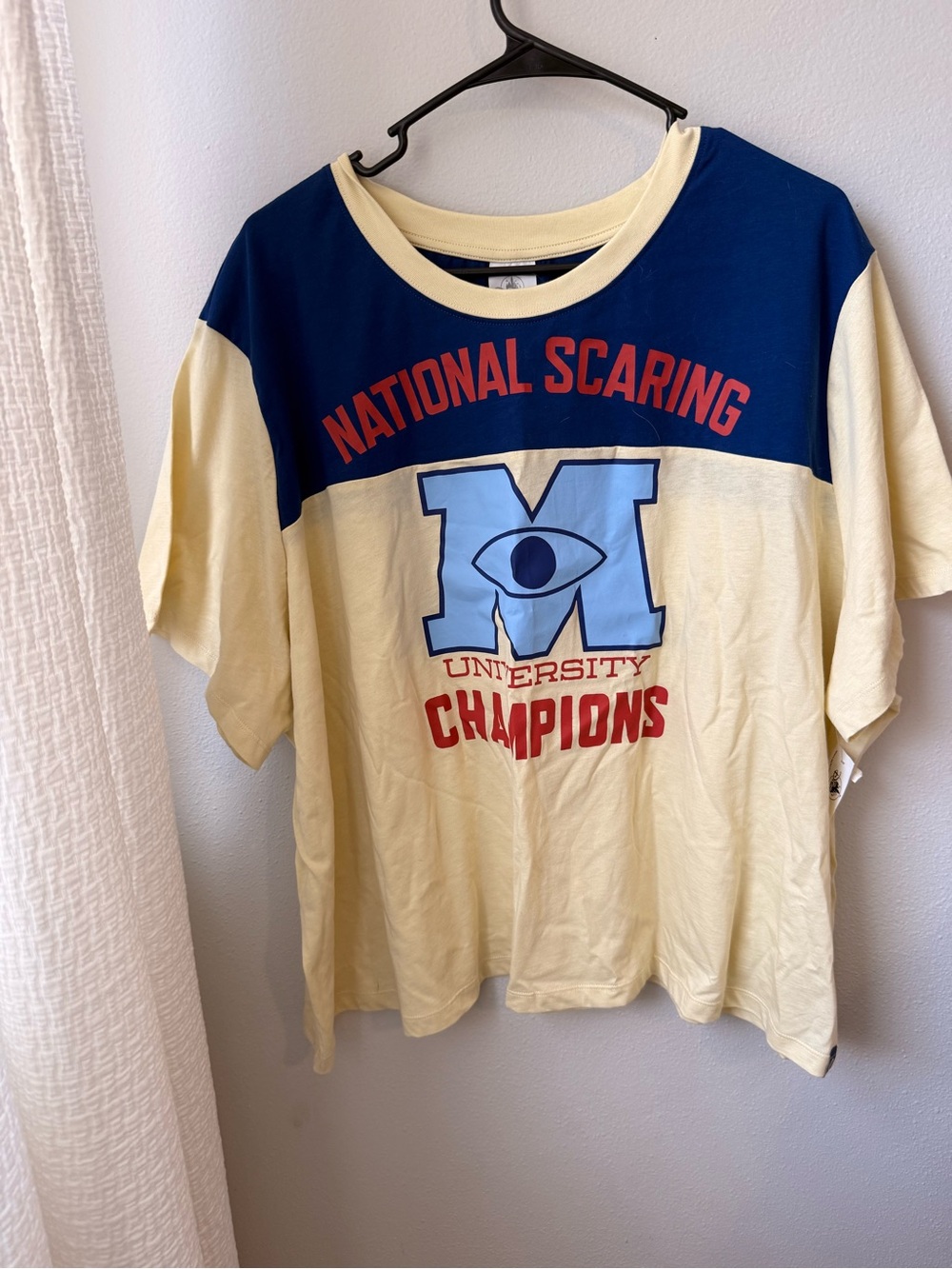 Disney Navy and Pale Yellow Varsity Graphic Tee with Red Accents
